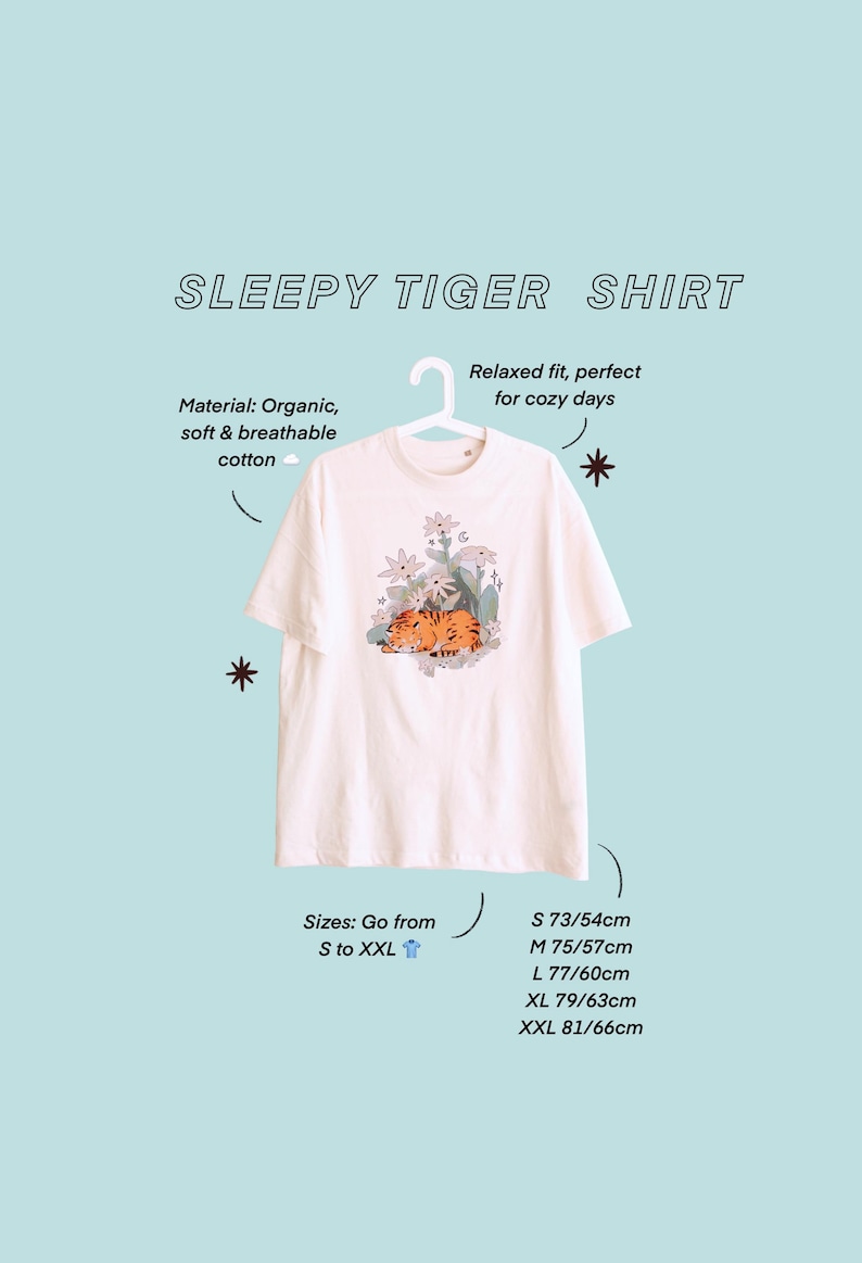 May include: Cream-colored t-shirt with a graphic of a sleeping tiger surrounded by flowers. The shirt is made of organic, soft, and breathable cotton. The text "SLEEPY TIGER SHIRT" is at the top. Sizes range from S to XXL, with measurements in centimeters.