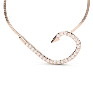 May include: A rose gold necklace with a diamond-encrusted hook pendant.