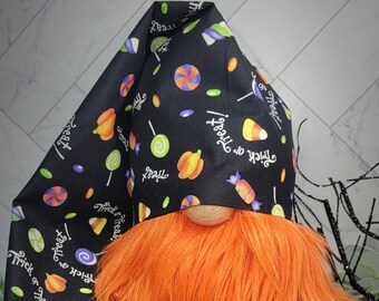 May include: A Halloween gnome with an orange beard and a black hat with a candy and "Trick or Treat" pattern.