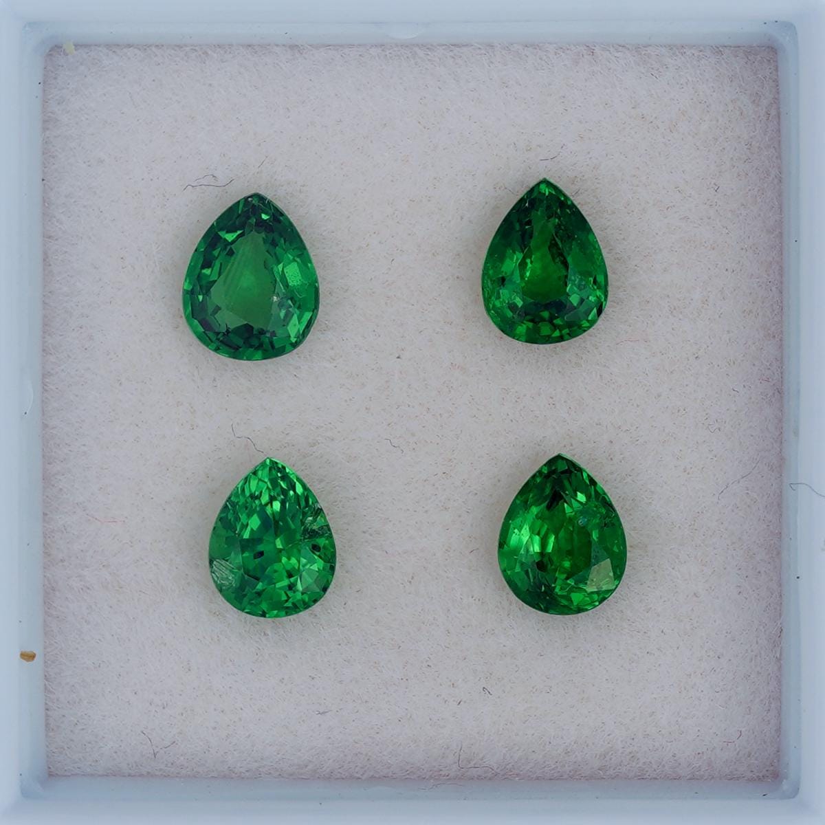 A Box of Small Genuine Tsavorite , Pear Cut, Green Garnet, Loose Gemstones, 4 pcs. 5x4 mm.(±0.2) 1.43 cts. (GM1180)
