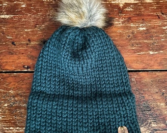 Pine green double brim knit hat made with 100% Peruvian Highland Wool and Faux Fur Pom-Pom.