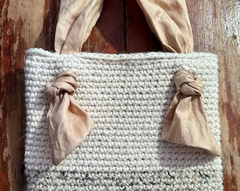 Handmade cream + oatmeal crochet tote bag with tan linen lining and tan linen straps. Approximately 13x13 inches +/- when laying flat.