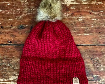 Ruby Red double brim knit hat made with 100% Peruvian Highland Wool and Faux Fur Pom-Pom.