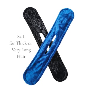 May include: Two hair styling tools in the image, one black and one blue. The blue one is on top of the black one. The text on the left says "Sz L for Thick or Very Long Hair". These are hair accessories.