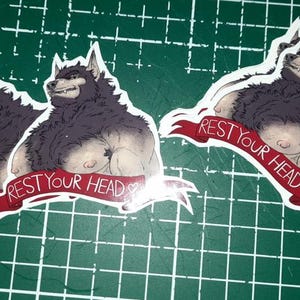 May include: Three stickers featuring a furry, anthropomorphic wolf with a red banner that reads "Rest Your Head".