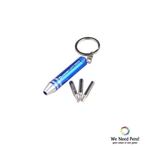 May include: A blue keychain screwdriver with the text "TRANSPORT-CITY TAXIS" printed on the side. The screwdriver has a silver ring and comes with four interchangeable screwdriver bits.