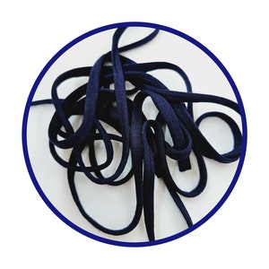 May include: A close-up of a dark blue elastic cord, a type of material used for crafting and sewing projects.