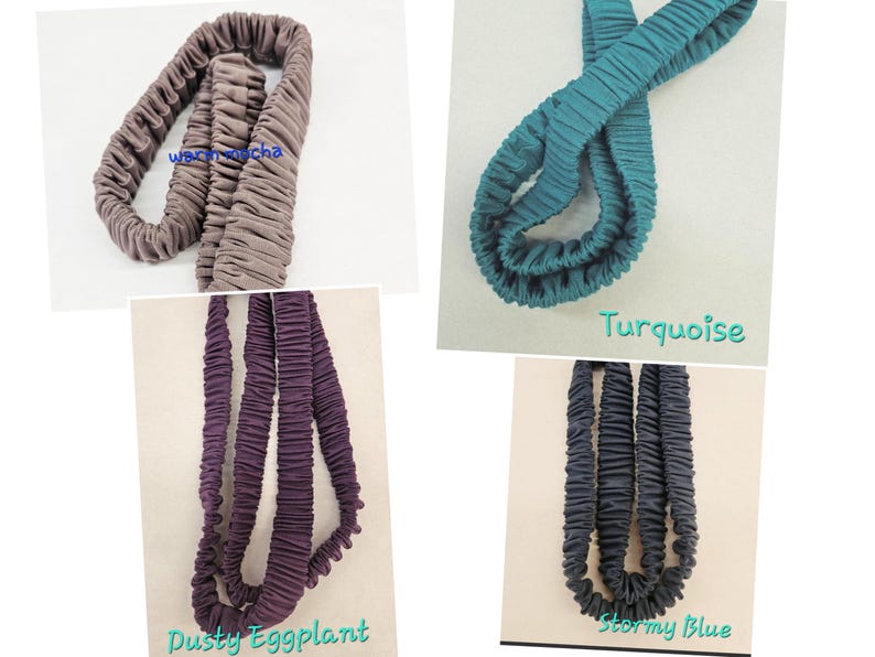 May include: Four fabric headbands in warm mocha, turquoise, dusty eggplant, and stormy blue. Each headband features a gathered, elasticized design with a soft, matte texture. The colors are labeled as warm mocha, turquoise, dusty eggplant, and stormy blue.
