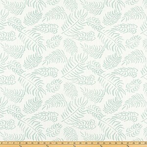 May include: White fabric with a repeating pattern of light blue fern leaves. The leaves are stylized and scattered across the surface. The fabric is suitable for various home decor projects.