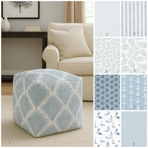 May include: A square ottoman with a light blue and white palm leaf pattern. The image also shows various fabric swatches with blue and white patterns, including stripes, coral, ferns, shells, anchors, sailboats, and a grid.