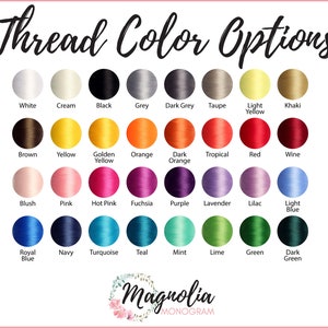 May include: A color chart displaying thread color options, including white, black, and various shades of blue, green, and pink. The text "Thread Color Options" is at the top, with the Magnolia Monogram logo at the bottom.