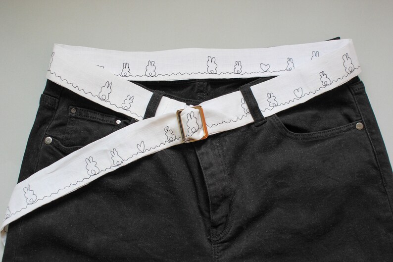 white fabric belt