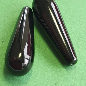 Pair Black Onyx 33 x 10mm half-drilled teardrop beads.