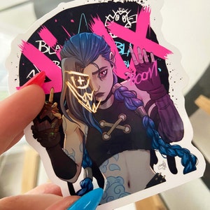 May include: A sticker featuring a cartoon character with blue hair and a black and white outfit. The character has a gold mask over their face and is holding a weapon. The sticker has a pink and black background with the words "Black Boom" written on it.