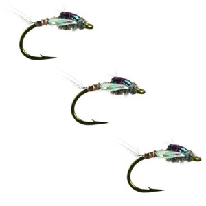 May include: Three fly fishing lures with iridescent green and purple wings, brown bodies, and gold hooks.
