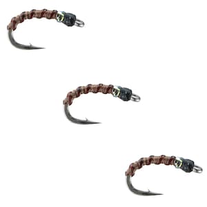 May include: Three brown and black fly fishing lures with silver hooks.