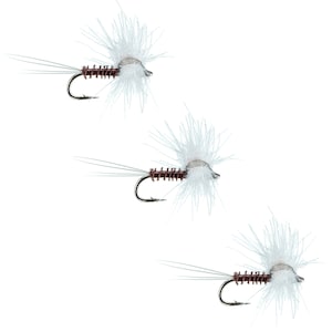 May include: Three white and brown fly fishing lures with white feathers and a brown body.
