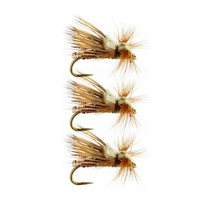 May include: Three brown and tan fly fishing lures with white and brown accents. The lures have gold hooks and are arranged vertically.