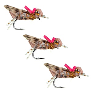 May include: Three brown and tan fishing flies with pink foam wings and gold accents.