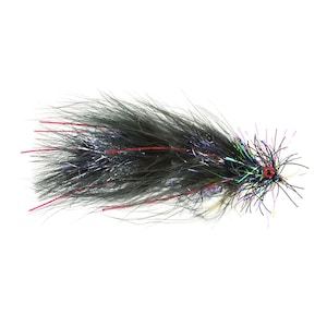 May include: A black and iridescent fishing fly with a red eye and red accents. The fly is made of various materials, including feathers and synthetic fibers, and is designed to mimic an insect.
