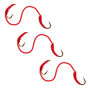 May include: Three red fishing lures with hooks and red string.