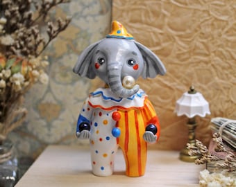 Elephant circus performer, clay figurine , animal miniature skulpture, elephant clown, magician, juggler, desk pet