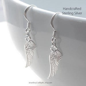 JewelleryCraftbyKC Angel Wing  All Sterling Silver Dangle Earrings
Dangle Earrings with your guardian angels
Guardian Angel Wing Earrings 925 Sterling silver, Drop Earrings, Everyday Jewelry, Simple Earrings, Minimalist, Dainty Earrings