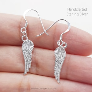 JewelleryCraftbyKC Angel Wing  All Sterling Silver Dangle Earrings
Dangle Earrings with your guardian angels
Guardian Angel Wing Earrings 925 Sterling silver, Drop Earrings, Everyday Jewelry, Simple Earrings, Minimalist, Dainty Earrings