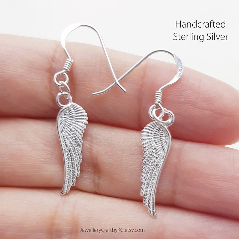 JewelleryCraftbyKC Angel Wing  All Sterling Silver Dangle Earrings
Dangle Earrings with your guardian angels
Guardian Angel Wing Earrings 925 Sterling silver, Drop Earrings, Everyday Jewelry, Simple Earrings, Minimalist, Dainty Earrings