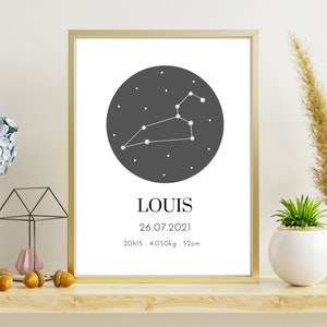 May include: A framed print with a gold border displays a Leo constellation graphic in white on a dark gray circle. The name "LOUIS" is below, along with the date 26.07.2021, time, weight, and height: 52cm.