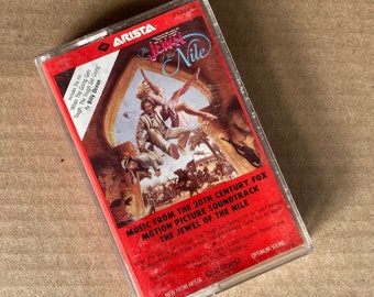 Billy Ocean, Jack Nitzsche, Whodini, et. al. ‘The Jewel of The Nile’ original motion picture soundtrack on a Jive/Arista audio cassette.