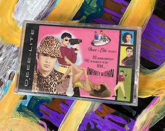 Deee-Lite ‘Infinity Within’ on a factory-sealed Elektra audio cassette.
