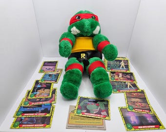 Vintage 1988 Playmates TMNT Raphael Plush Lot | 14" Stuffed Figure & 47 Topps Cards | Retro 80s Ninja Turtles Display Set