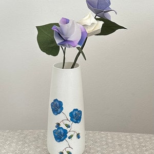 Decoupaged glass vase  with a paper napkin of blue flowers. Origami roses included