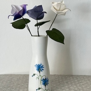 Decoupaged glass vase  with a paper napkin of blue flowers. Origami roses included.