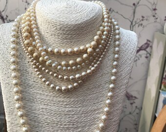 Vintage Collection of Mid Century Faux Pearl necklaces 6 items including Pierre Cardin and Silver Clasp