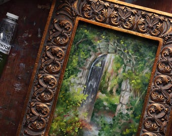 Origineel kunstwerk ingelijst in tuinhek