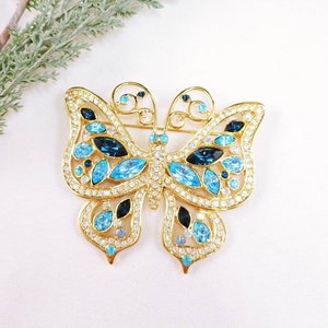 Vintage Butterfly Brooch: Blue Faux Sapphire Rhinestone Gold Tone Pin