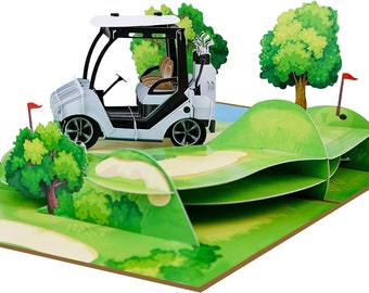 Peut inclure: Une carte pop-up 3D représentant un chariot de golf blanc avec des accents noirs conduisant sur un terrain de golf vert. La carte est ouverte et montre un terrain de golf vert avec un bunker de sable et un drapeau.