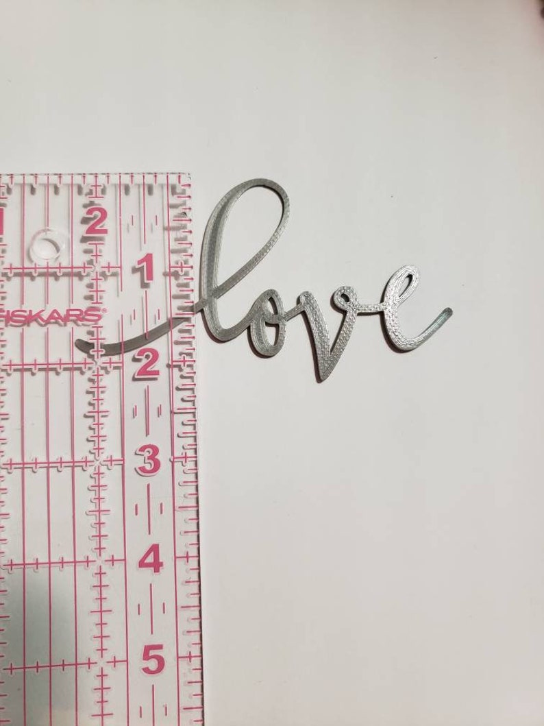 3D printed word Love