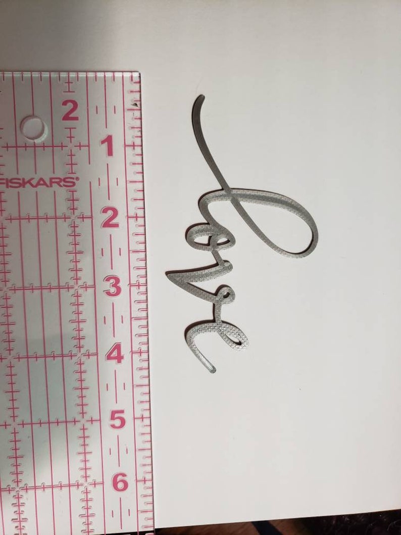3D printed word Love
