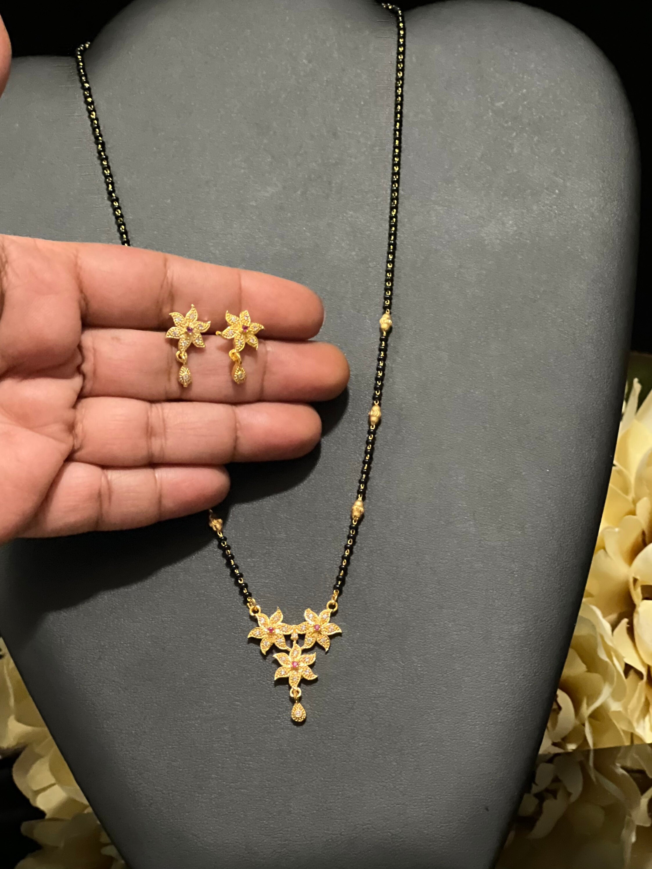 Gold black beads mangalsutra with price deals