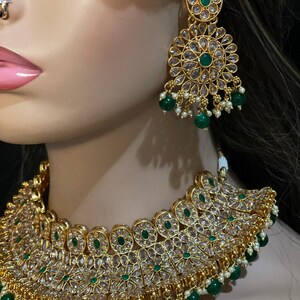 Polki Diamond,
Diamond Polki,Gift for Her,
Polki Kundan Set
Unique Necklace,
Polki Necklace,
Tyaani jewelry set,
Tyaani inspired,
Pachi Kundan Set,
Faux Diamond Set,
Kundan Polki Set
Emerald Jewelry,
Uncut Polki Jewelry,
Polki Choker,
Punjabi Jewelry