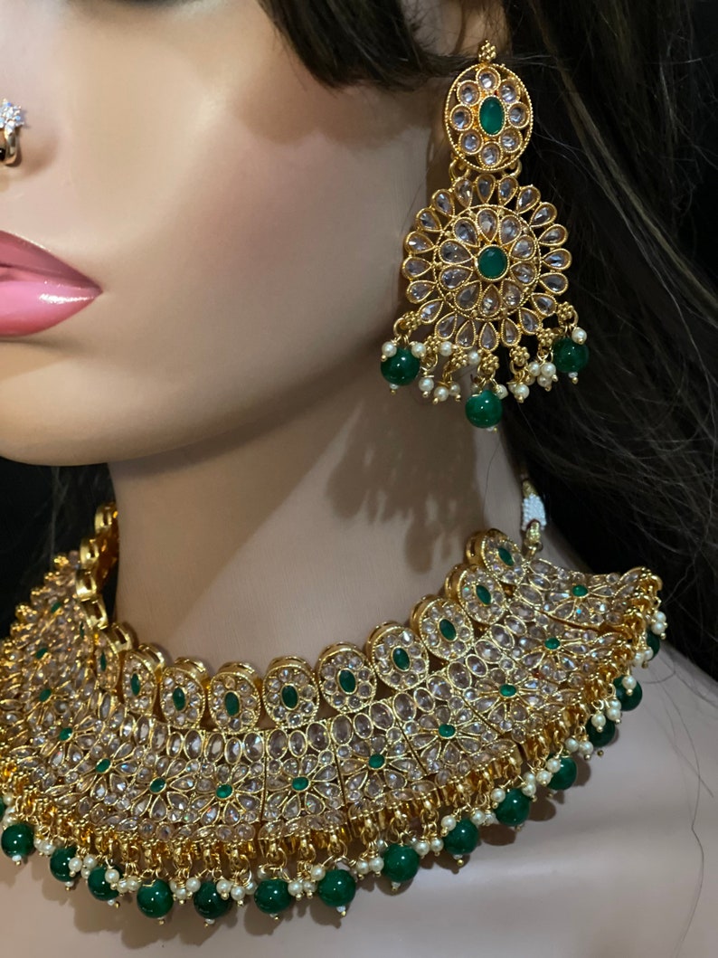 Polki Diamond,
Diamond Polki,Gift for Her,
Polki Kundan Set
Unique Necklace,
Polki Necklace,
Tyaani jewelry set,
Tyaani inspired,
Pachi Kundan Set,
Faux Diamond Set,
Kundan Polki Set
Emerald Jewelry,
Uncut Polki Jewelry,
Polki Choker,
Punjabi Jewelry