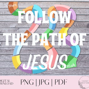 May include: A colorful game board with a path shaped like a heart. The path is made of colorful pieces that are connected together. The words "Follow the Path of Jesus" are written in white letters on a wooden background. The words "Start" and "Finish" are also written on the board.