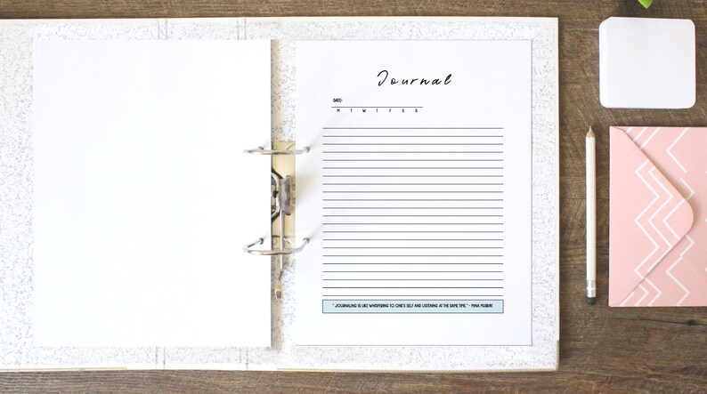 May include: A white binder with a blank page on the left and a page with the word "Journal" and lined paper on the right. The page also has the text "Journaling is whispering to ones self and listening at the same time." -  Anna Plummer