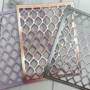 May include: Three decorative die-cut paper frames in shades of lavender, rose gold, and silver. Each frame features a repeating geometric pattern of interconnected ovals. The edges are finished with a stitched border.