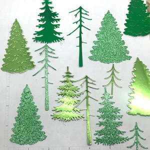 May include: Assortment of green glitter paper cutouts of various pine tree shapes.