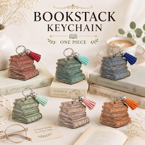 May include: Bookstack keychain featuring a stack of books with a tassel. The keychain is available in various colors, including red, green, blue, and orange. The text "BOOKSTACK KEYCHAIN" and "ONE PIECE" are visible.