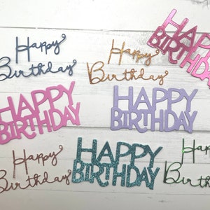 May include: Assortment of six happy birthday banners in various colors and styles. The banners are made of glitter paper and have a festive look.